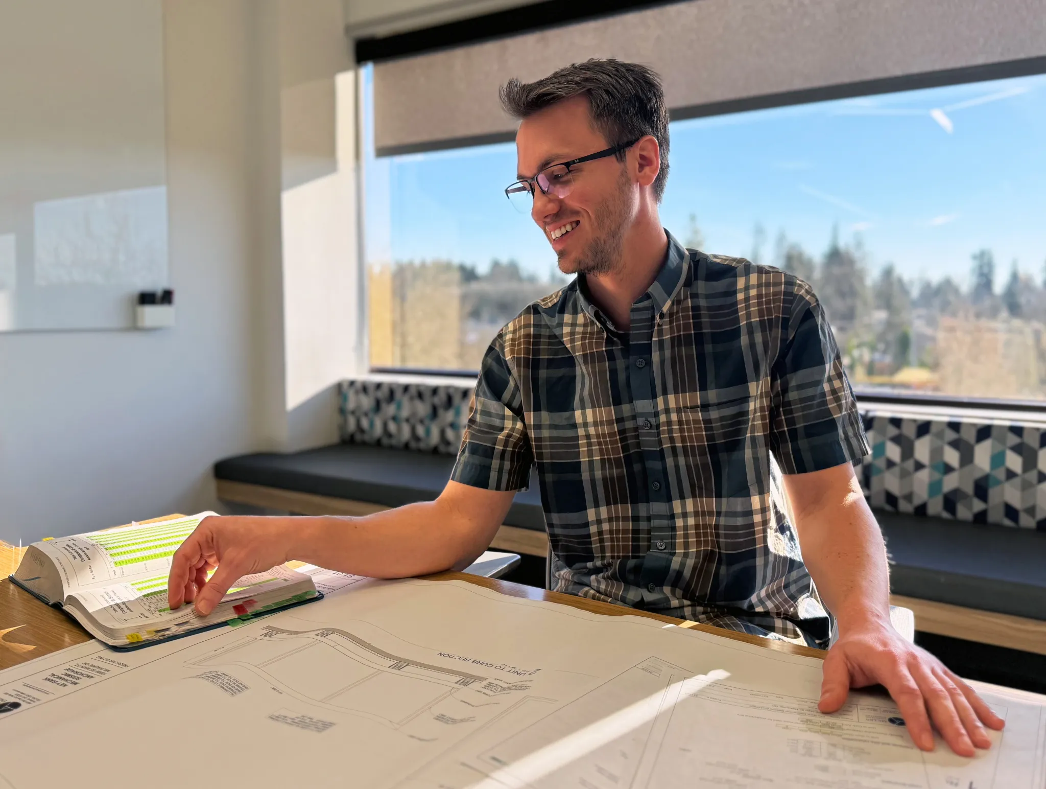 MCE engineer reviewing project drawings